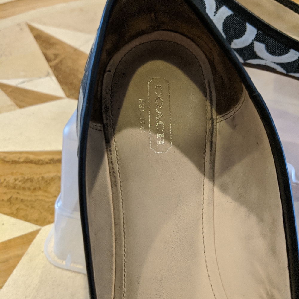 Black and white Coach flats